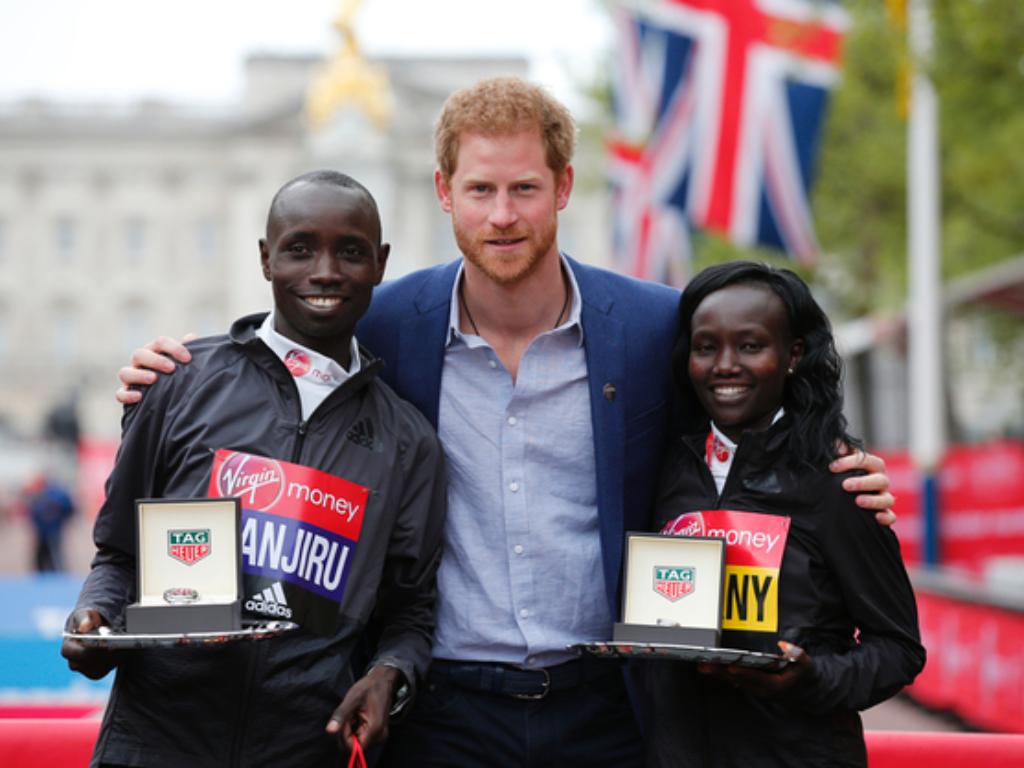 David Wanjiru and Mary Keitany pose with Prince Harry