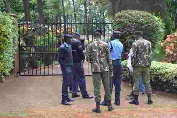 officers guard muringi home