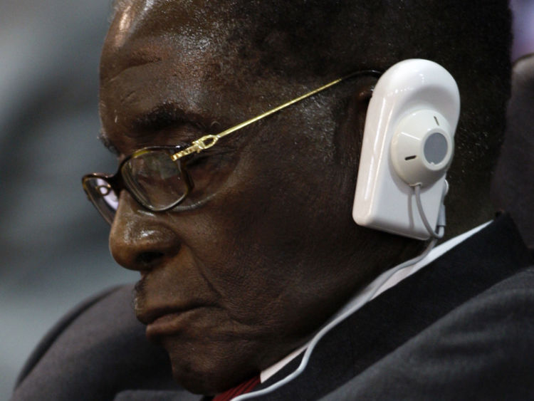 Mr Mugabe closes his eyes during an Africa Union meeting in July 2005
