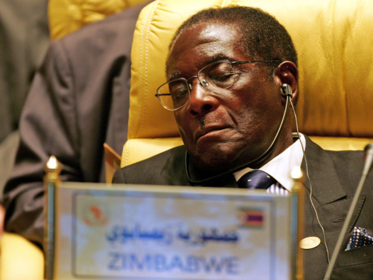 Mr Mugabe closes his eyes during an Africa Union meeting in July 2005
