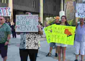 Protesters Carrying "Welcome to Kenya" Placards Welcome President Donald Trump in Hawaii