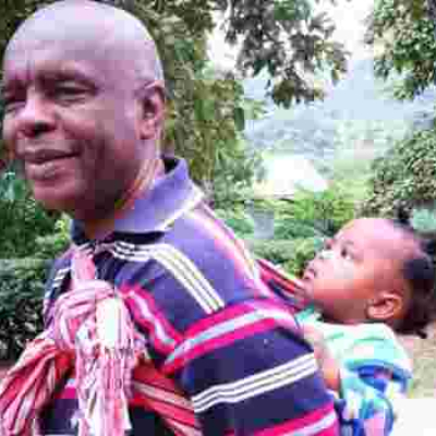 Photo of Makueni Governor Prof Kivutha Kibwana Carrying Child on His Back Goes Viral Online 