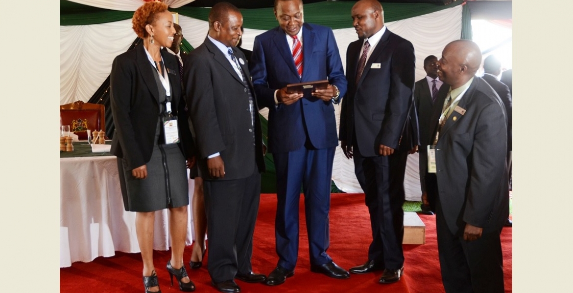 Members of the Board of the Kenya USA Diaspora SACCO with President Kenyatta at a luncheon they hosted in honor of participants of Diaspora Conference held at Windsor Golf and country club in April, 2015.