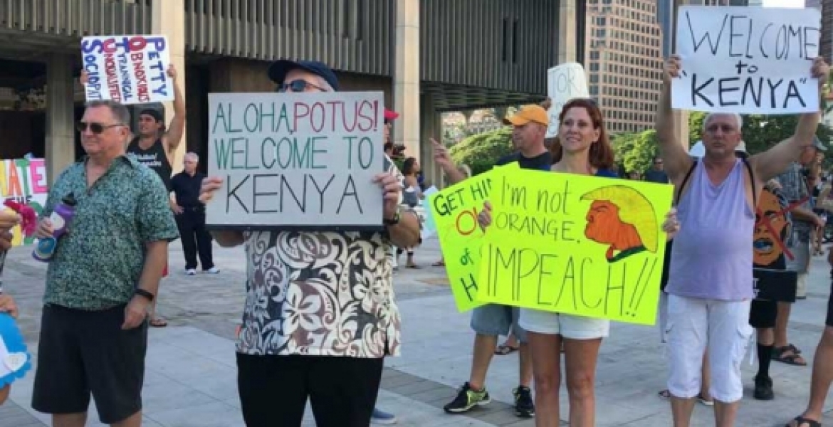 Protesters Carrying "Welcome to Kenya" Placards Welcome President Donald Trump in Hawaii