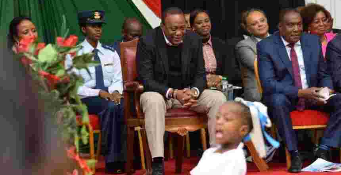 Kenya's First Female Aide-de-Camp RN Kamui Accompanies President Uhuru to a Public Event