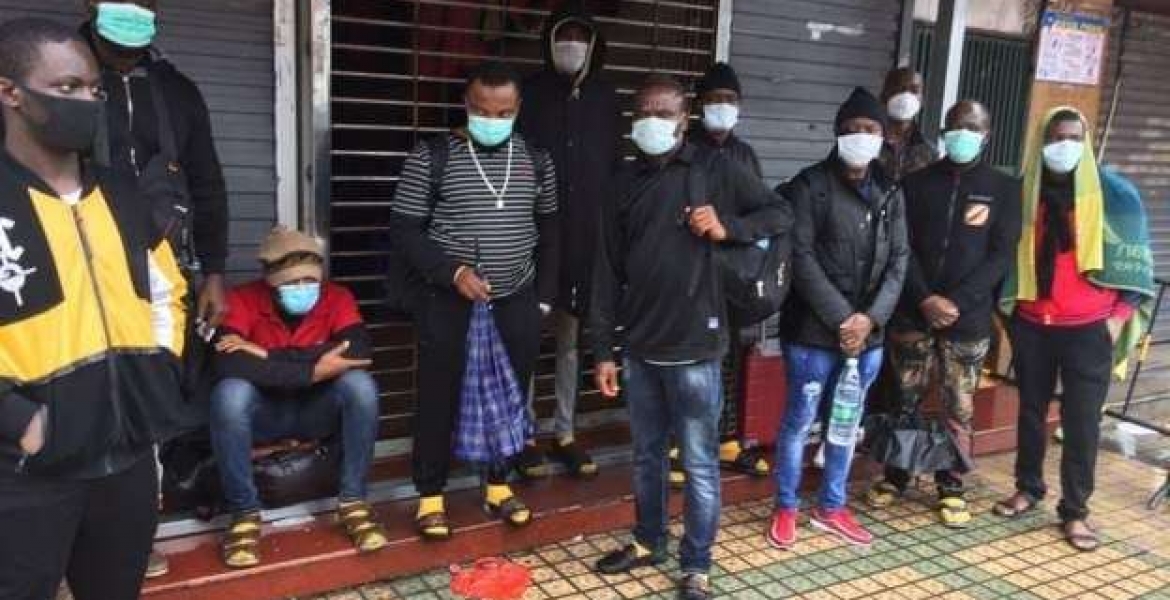 A group of Africans stranded in the streets after they were evicted from their houses in China Government Reacts to Reports of Racial Attacks on Kenyans Living in China