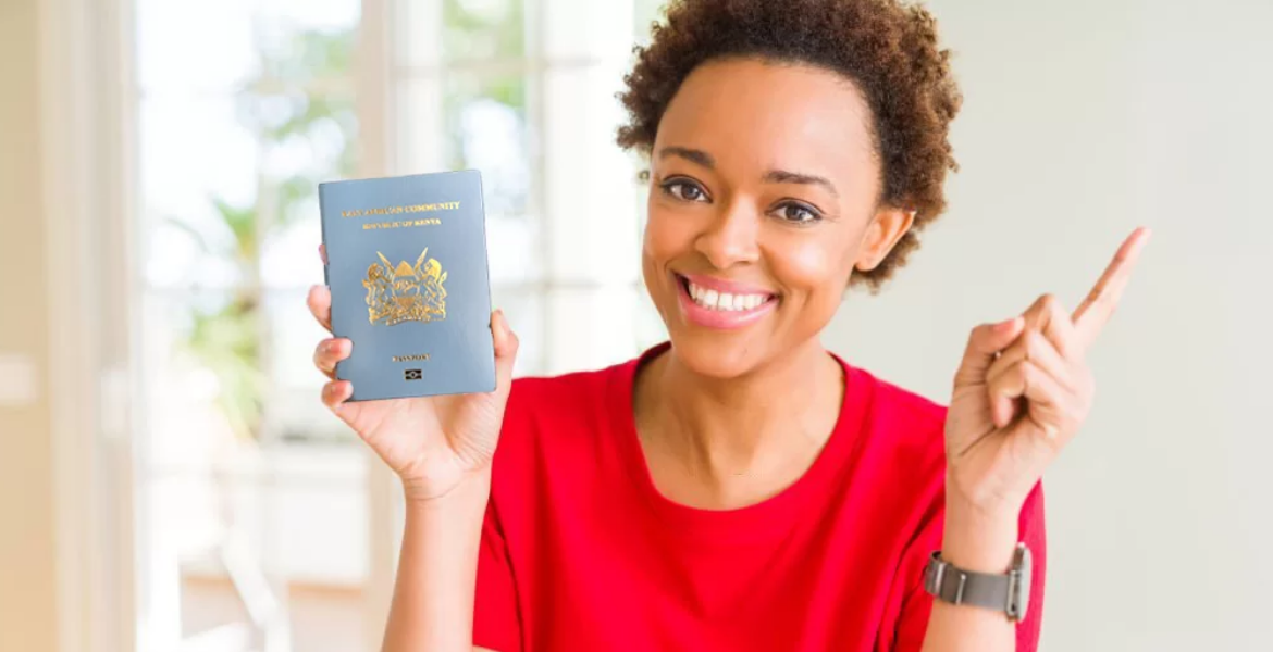 Woman Holding a Kenyan Passport Why Kenyans Can't Apply or Collect Passports -Immigration Department