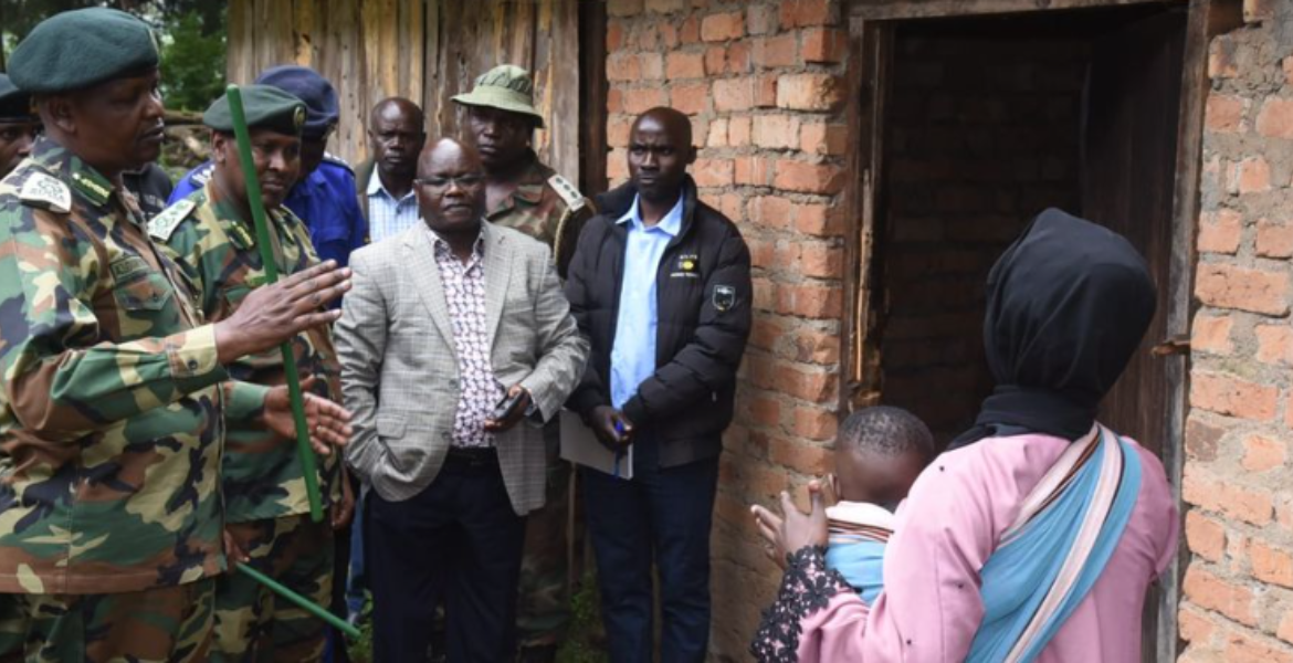 Chief Conservator of Forests Alex Lemarkoko (left), accompanied by other officers, condoles with the widow of one of the Kenya Forest Service officers at Cherang'ani Forest Station Policeman Kills Two Before Taking Own Life in Elgeyo Marakwet County