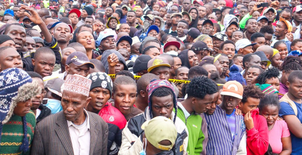 Hundreds of locals mill around the Kware area of Pipeline after bodies were discovered Gunfire and Unrest as More Bodies are Retrieved from Kware, Mukuru Slums