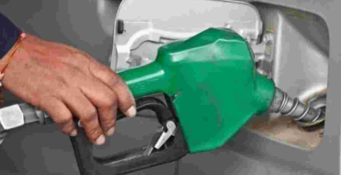 Fuel Attendant Holding a Fuel Pump EPRA Slashes Fuel Prices by Sh4.37 per Litre Ahead of Festive Season in Kenya