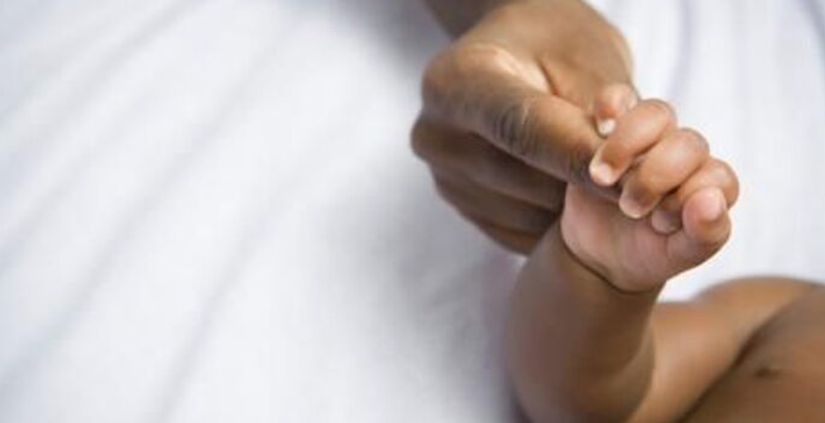 A Mother Holding her Child's Hands in Hospital More Kenyan Couples Are Choosing to Adopt Girls Over Boys