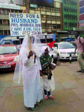 Woman Carries Placard in Streets of Nairobi in Search of Husband 