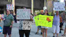 Protesters Carrying "Welcome to Kenya" Placards Welcome President Donald Trump in Hawaii