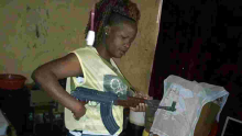Photos of Gun-Wielding Kenyan Woman Go Viral Online, Kenyans Call for Her Arrest
