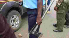 Kenyan Policeman Pictured Handling Murder Weapons with Bare Hands, Kenyans React
